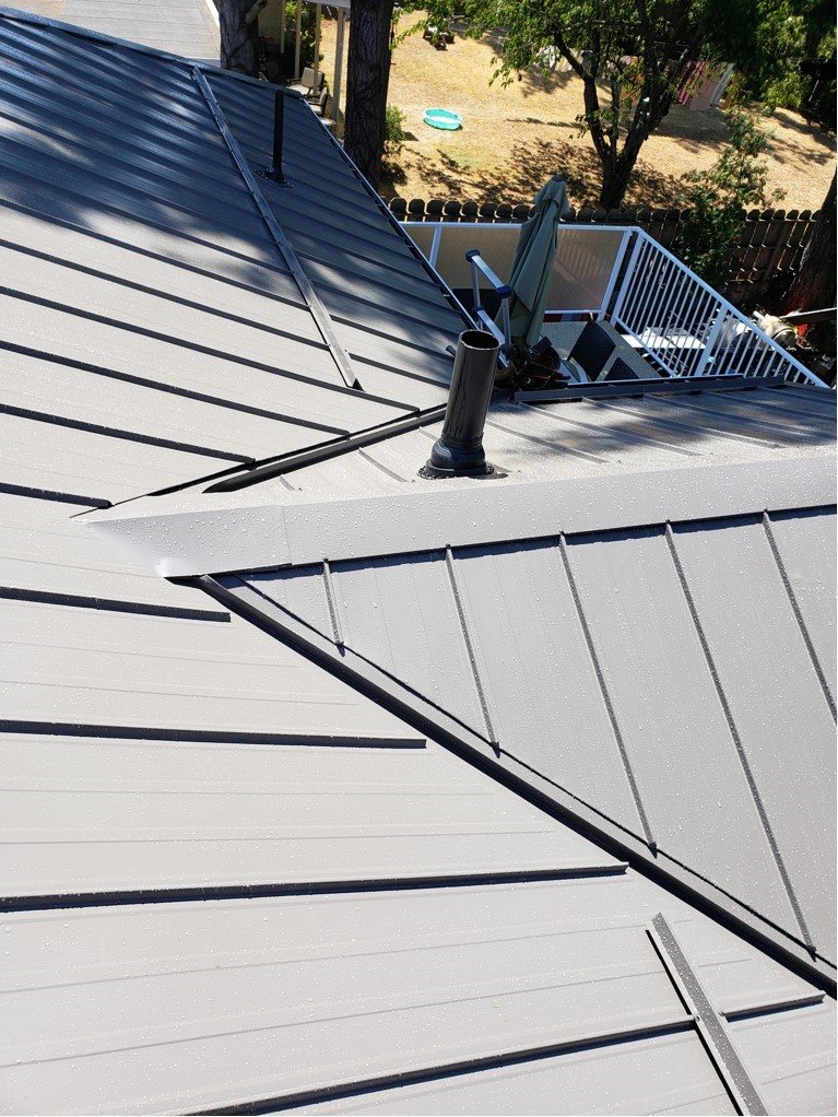 Metal roof valley and vent