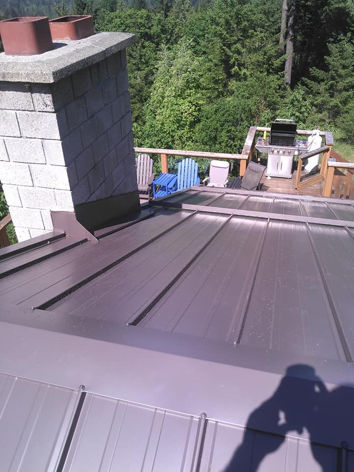 Metal re-roof beside a deck