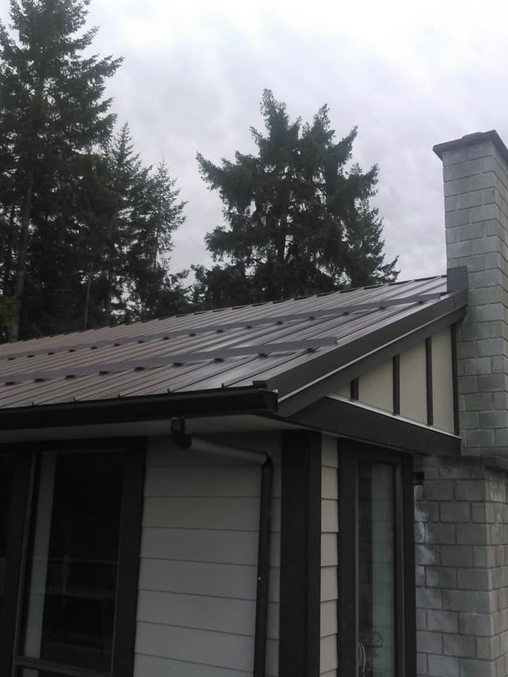 Re-roofed house with a metal roof